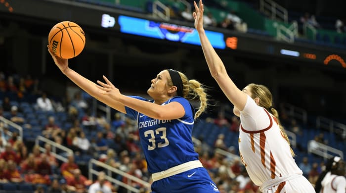 Creighton Bluejays guard Payton Brotzki (33) beats Iowa State Cyclones guard Emily Ryan (11) to the basket in the fourth quarter in the Greensboro regional semifinals of the women’s college basketball NCAA Tournament at Greensboro Coliseum.
